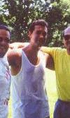 The guy in the middle is holding up the other two.